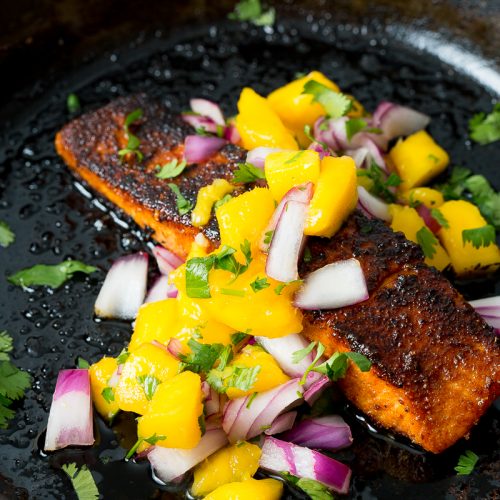 cooked up salmon in cast iron skillet