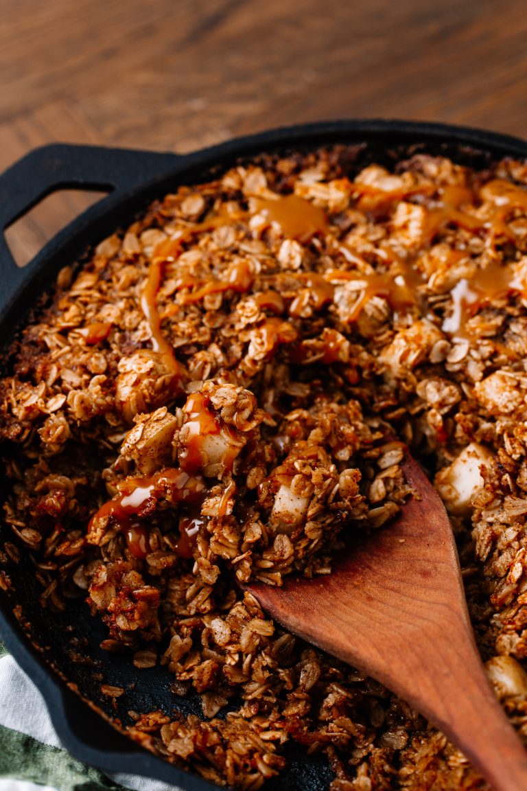 Overhead image of apple cinnamon baked oatmeal in a cast iron skillet