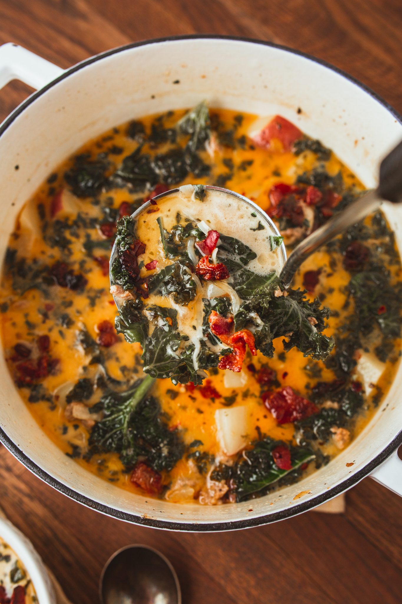 overhead image of zuppa toscana in a dutch oven