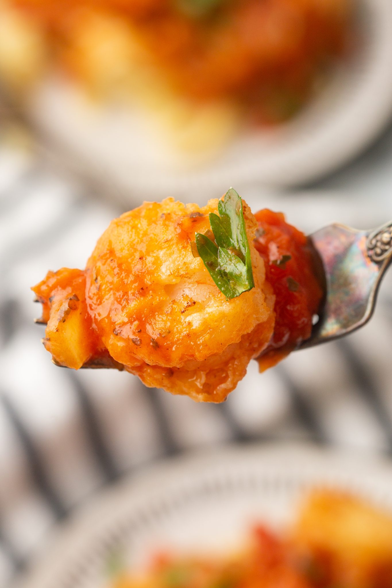 shrimp parmesan on a fork