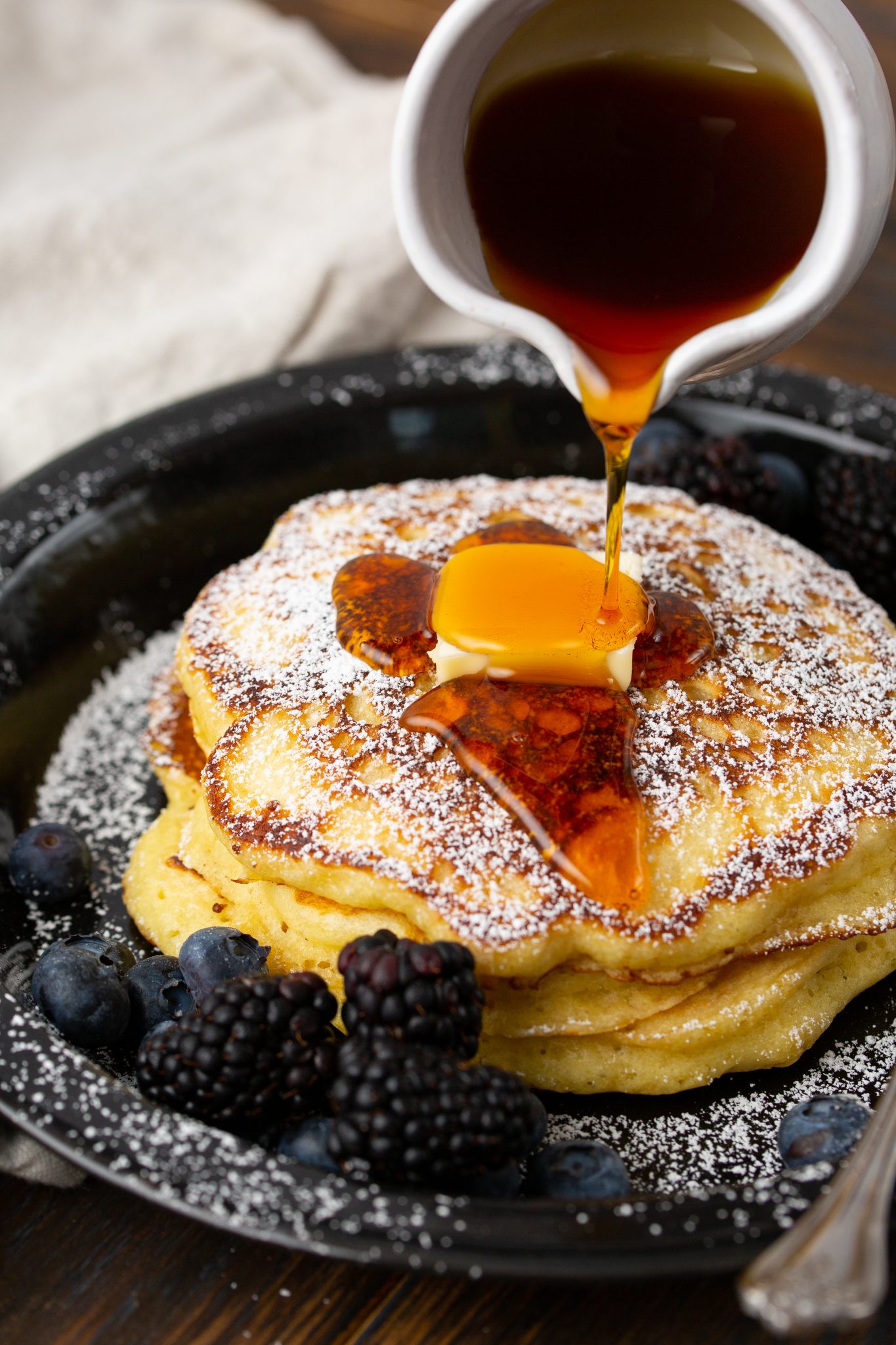 warm maple syrup poured over fresh buttermilk pancakes