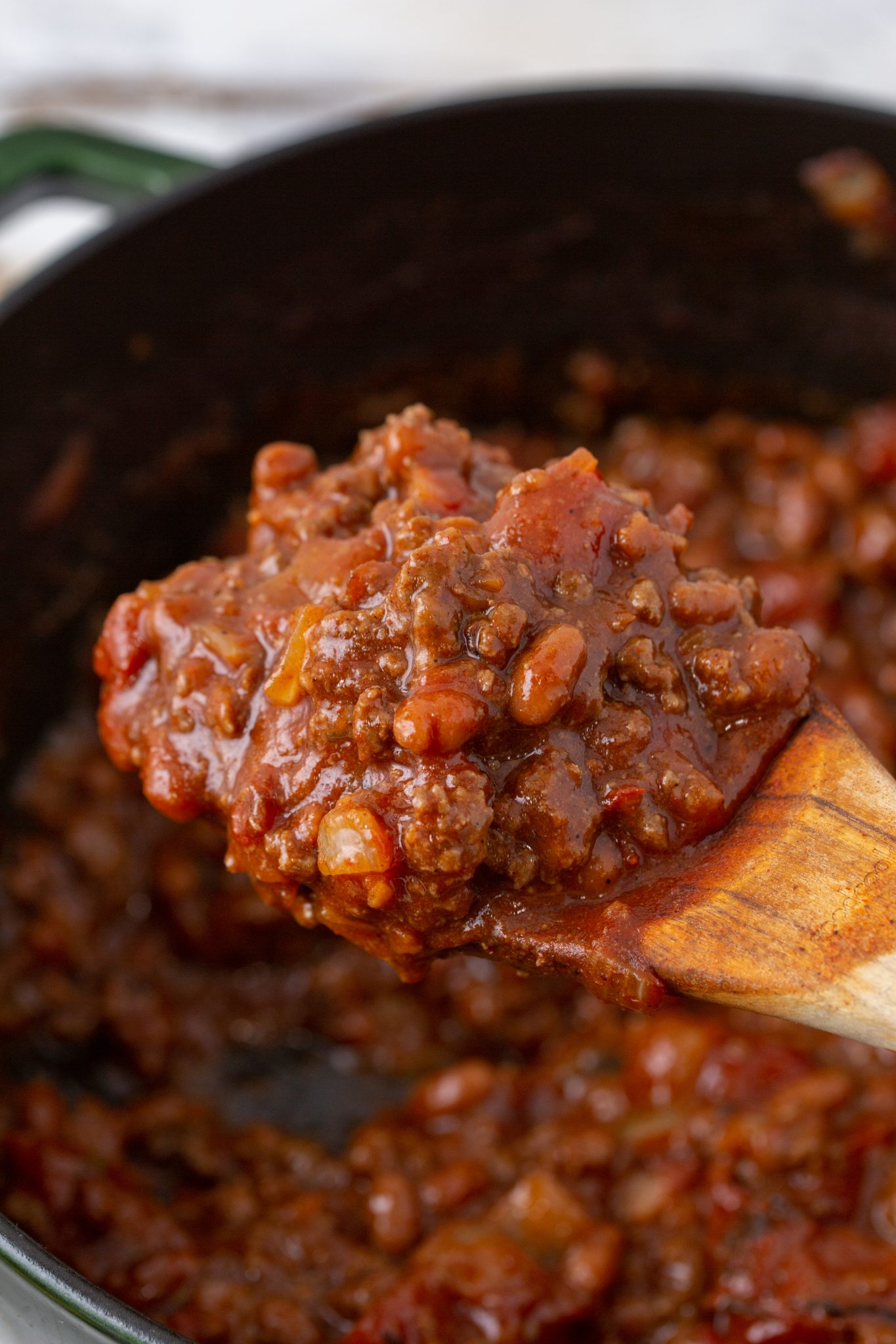 Easy Baked Bean Chili spooned over a Dutch Oven
