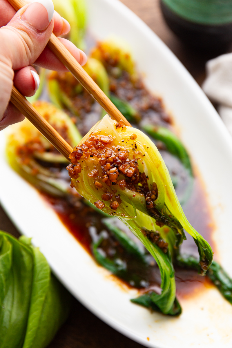 bok choy in garlic sauce with chopsticks